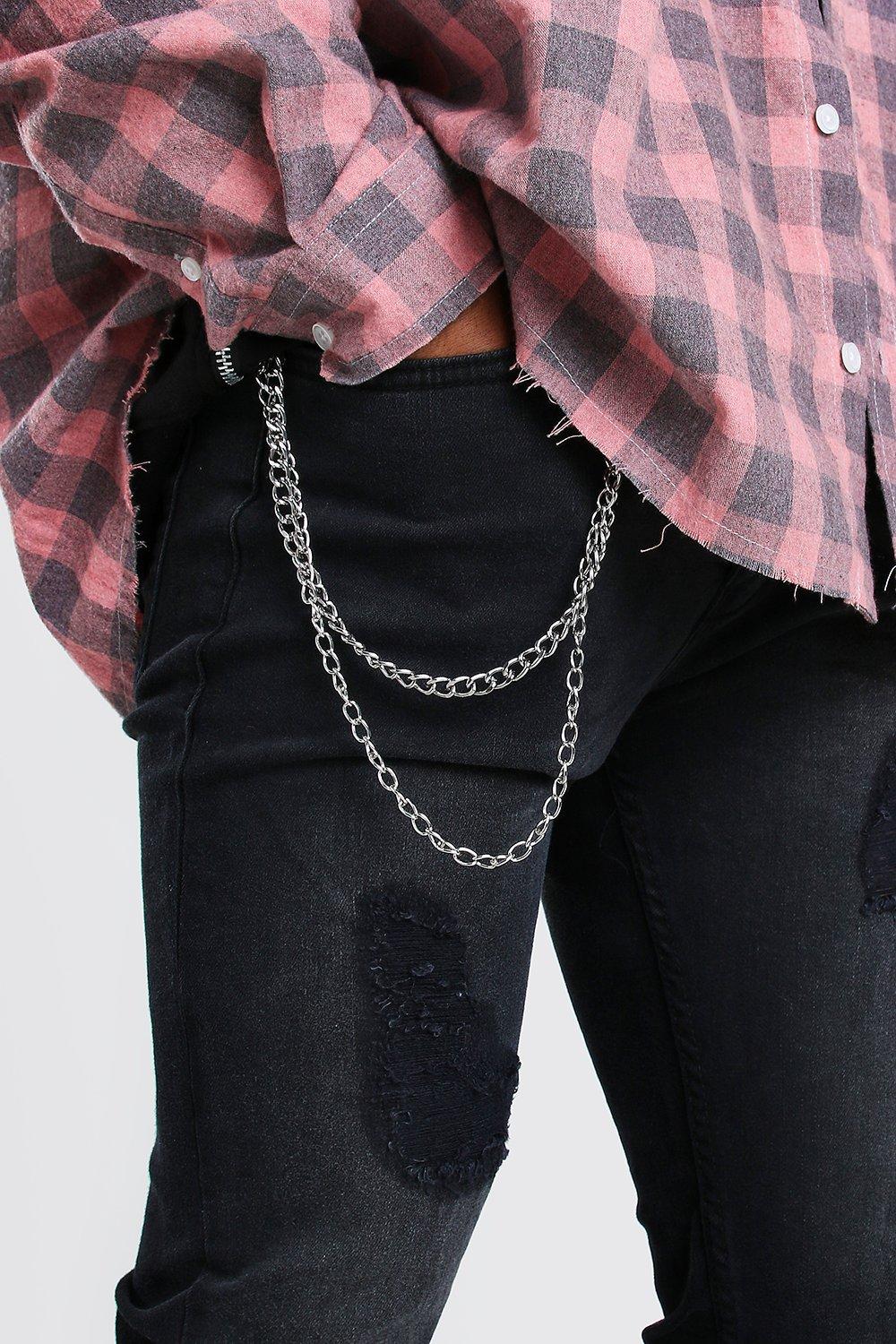 Jeans with store rips and chains